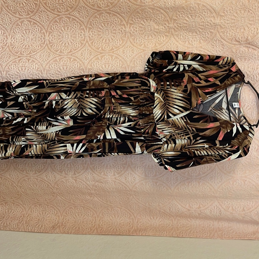 Brand new. Never wore, it was a bit big for my shoulder area